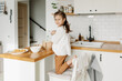 © laniko - Adorable girl preparing icing pancakes at the kitchen. Concept of food preparation. Casual lifestyle photo series in real life interior