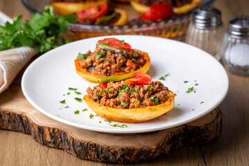 Wall Mural - Traditional Turkish food; baked potato dish with minced meat, Turkish name; Patates karniyarik