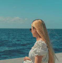 Wall Mural - woman relaxing on the beach sea 