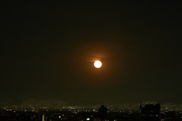 Wall Mural - view of the full moon with few clouds