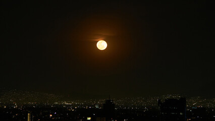 Wall Mural - view of the full moon with few clouds