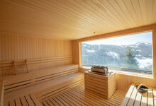 Empty Wooden Sauna Room With Traditional Sauna Accessories