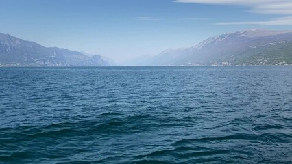 Wall Mural - Landscape of Lake Garda seen from a ferry crossing the lake