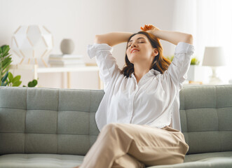 Wall Mural - woman resting on a sofa