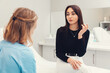 © _KUBE_ - A young woman consults with a doctor at the clinic. The concept of cosmetology and psychology