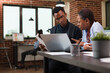© DC Studio - Marketing company financial department team brainstorming ideas to be used by boardroom executives. African american office workers reviewing accounting documentation papers