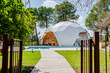 © Westend61 - Exterior of dome shaped room by swimming pool at hotel
