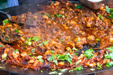 Wall Mural - Stewed beef with potatoes at Brick Lane market in London