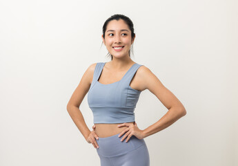 Wall Mural - Young beautiful asian woman with sportswear on isolated white background. Portrait sporty woman standing pose exercise workout in studio.