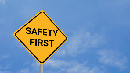 Safety First Road Sign on Clear Blue Sky with Rapid Moving Clouds for Text Placement