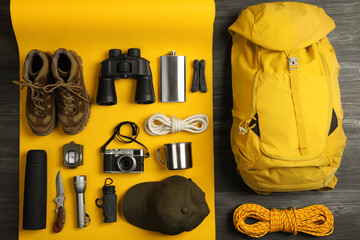 Wall Mural - Flat lay composition with different camping equipment on color background. Traveler set