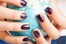 Woman Hands With Purple Manicure Holding Earth Ball, Global Planet Issues Concept