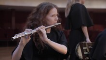 Girl Plays The Flute By Notes In The Theater, Rehearsal Before The Concert 