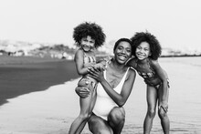 African Sister Twins Having Fun With Mother On The Beach - Main Focus On Mom Face - Black And White Editing
