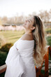 © sorin - concept good morning, blonde woman on the balcony covered with white duvet. morning woman portrait