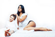 © iordani - cute little boy in bed with mother in pajamas having fun happy smiling, lifestyle people concept