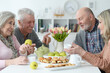 © aletia2011 - Portrait of two senior couples drinking tea