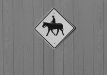 Diamond Shaped Horse Crossing Or Horse Rider Sign In Blacl And White Signifying Riding Horses In The Area Or Horse Crossing Road Diamond Shaped Sign With Silhouette Of Horse And Rider Horizontal 