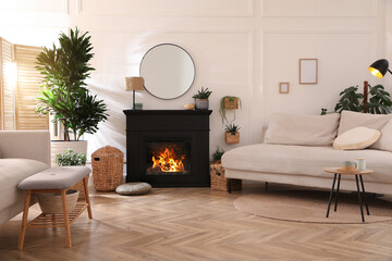 Sticker - Stylish living room interior with electric fireplace, comfortable sofas and beautiful decor elements