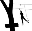 children in adventure park rope ladder.in adventure park rope ladder. Silhouette Adventure. Woman on cables in an adventure park on a difficult course	