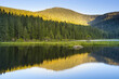 Beautiful Small Arber lake in the Bavarian Forest at sunset. View to mount Großer Arber.
