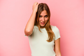 Young caucasian woman isolated on pink background tired and very sleepy keeping hand on head.