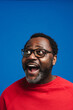 © Drobot Dean - Black bearded man in eyeglasses expressing surprise at camera
