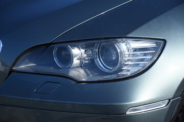 Wall Mural - Car's exterior details.Blue car - headlight on a blue  car