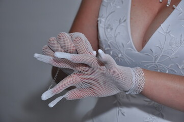 bride with her hand on her dress, detail