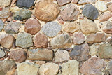 Fototapeta Desenie - Fragment of an old stone wall. Ancient rock background