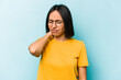 © Asier - Young hispanic woman isolated on blue background having a neck pain due to stress, massaging and touching it with hand.