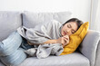 Asian Woman Cover with Blanket Sleep on the Sofa