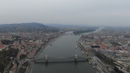 Wall Mural - Cinematic 4k aerial video of Budapest with view on the Danube river, parliament building and Sziget island