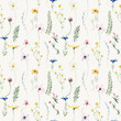 Watercolor floral seamless pattern. Yellow chamomiles, blue cornflowers, violet, pink wild flowers on beige background.