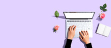 Woman Using Her Laptop With Pink Roses - Flat Lay