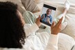 © opolja - African american woman video calling boyfriend on tablet. Couple talking dating by virtual meeting via videocall