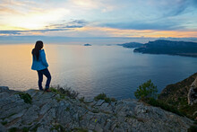 Woman Standing On Top Of A Cliff At The French Cote D'Azur