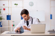 © Elnur - Young male doctor radiologist working in the clinic
