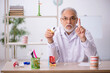 © Elnur - Old male dentist working in the clinic