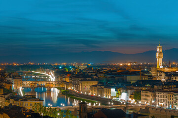 Fototapete - Florence city during sunset. Panoramic view to the river Arno, with Ponte Vecchio and  Palazzo Vecchio , Florence, Italy