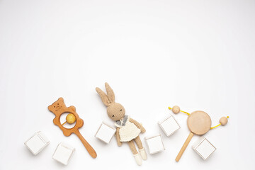 Wall Mural - Wooden cubes with baby toys on white background