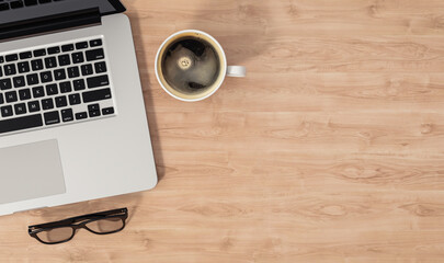 Wall Mural - Laptop, coffee cup and glasses on wooden table, top view with copy space, 3d illustration