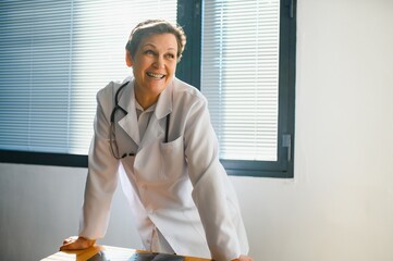 Portrait of senior female doctor in her office.