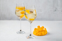 Dessert Champagne Jelly With Exotic Fruits - Mango And Pitahaya In A Glass. On A White Background