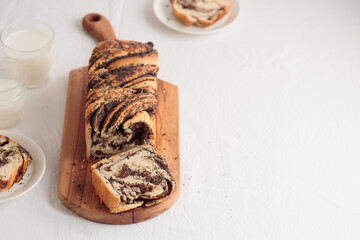 Wall Mural - Sweet swirl homemade bread with poppy seeds