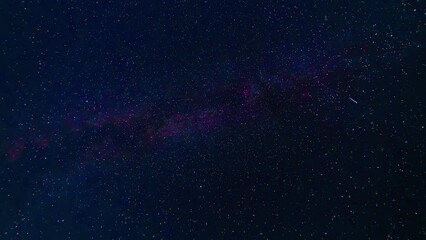 Wall Mural - starry night blue sky with the milky way and a lot of falling multicolored shining stars