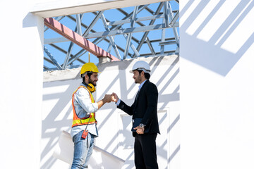 Aufkleber - Businessman and architect shake hand success at construction site,Partnership,Teamwork,Community,Connection industrial and investment concept.