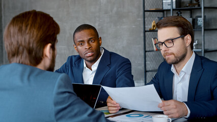 Wall Mural - Young leader with a business team at a meeting in workplace