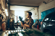 Destroying Gender Stereotypes. Young Woman Auto Mechanic Working At Auto Service Station Using Different Work Tools. Gender Equality. Work, Occupation, Car