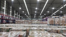 The Stock Of Products In The Warehouse Already Cover With Plastic And Arranged Well And Ready To Distribute